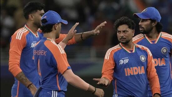 Kuldeep Yadav, second right, celebrates the wicket of UAE's Rahul Chopra during the Asia Cup on Wednesday. (AP)